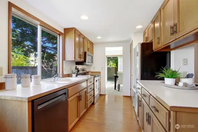 Kitchen has wonderful natural light and ample storage and counter space.
