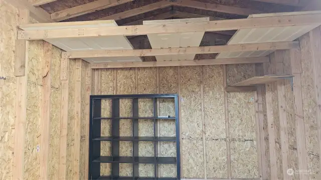 Built-in shelves in shed to maximize the storage space.