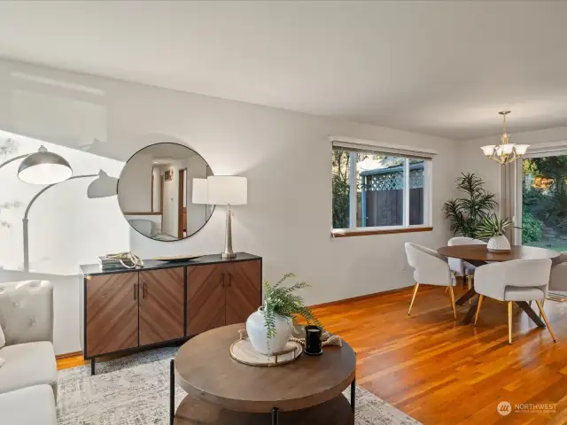 The living room and dining room open up to each other for great flow and windows allow in light on all sides