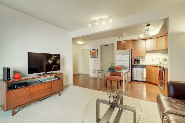 Here's another view from the north end of the living room looking towards the kitchen and entry. Can't you imagine relaxing with dinner and your favorite tv show in this comfortable and quiet home?