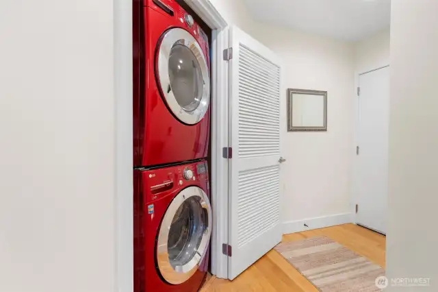 Conveniently located just off the entryway, this dedicated laundry closet features a full-size, front-loading washer and dryer—making everyday chores a breeze without sacrificing space or style.