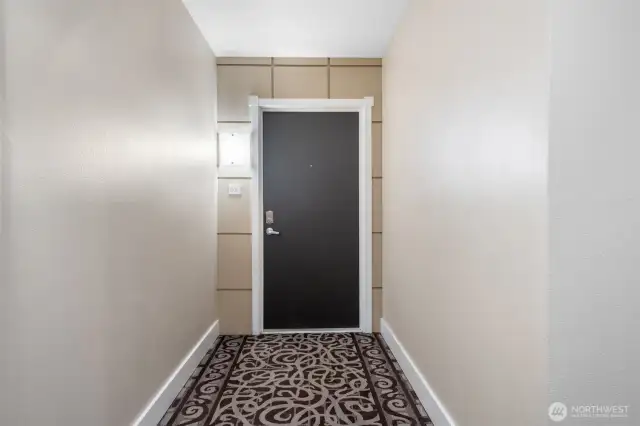 Welcome to Unit #206—nestled at the end of the hallway, this secure entry features a modern keypad lock for both convenience and peace of mind as you step into your stylish downtown Kirkland retreat.