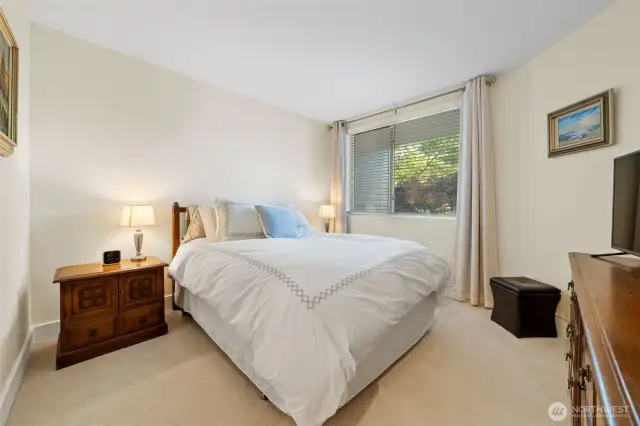 Welcome to the primary suite, a private retreat featuring a spa-like bath and a spacious walk-in closet for effortless organization. A pocket door adds separation from the main living area, enhancing comfort and privacy.