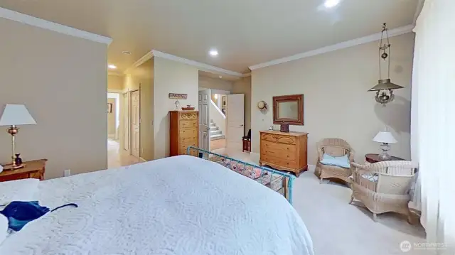 Main-level bedroom. 4 sets of closets in hallway to bathroom.