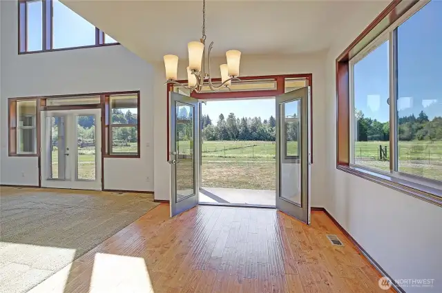 dining room off kitchen and living area with french doors to patio - overlooking your pastures