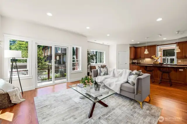 Main floor well-appointed layout: living room with a gas fireplace and a sliding door to a balcony opens to Gourmet kitchen with an entertainment size island and a breakfast nook.