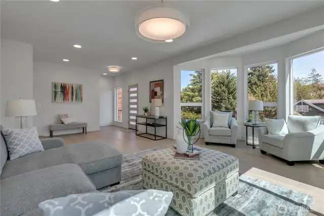 Unit B living room angle looking toward the entry & bow window design.