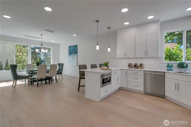 Unit B view of open main floor kichen & dining space.