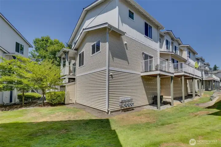 Side and rear view of this beautiful end unit showing the outdoor deck