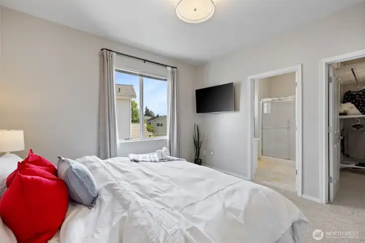 View of Primary bedroom showing access to the Primary bath and walk-in closet
