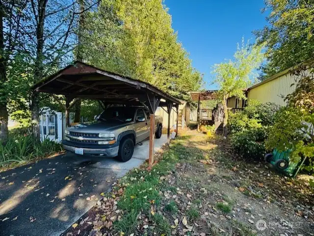 1-car carport and yard space.