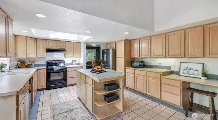 Enjoy a sunlit kitchen with a skylight overhead and the bonus of included appliances—ready for your culinary adventures.