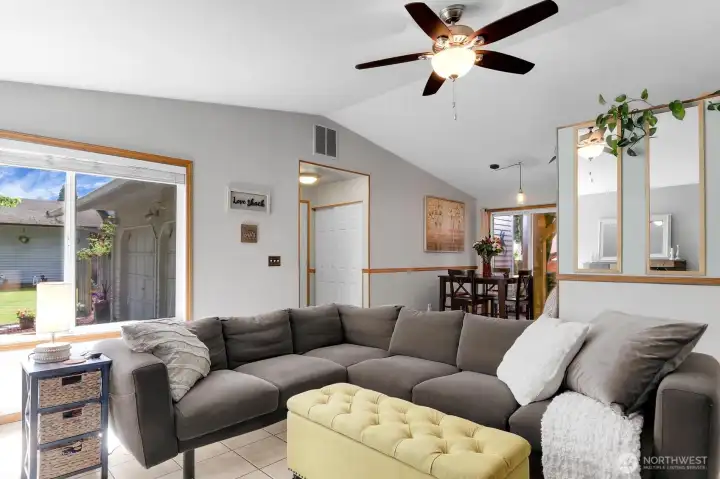 Sliders from dining room to covered outdoor seating and dining area