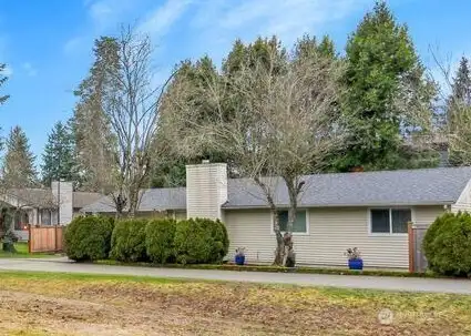 View to the SW from the included lawn area across the private drive.