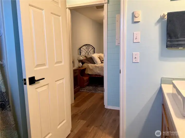 Bathroom leading to bedroom