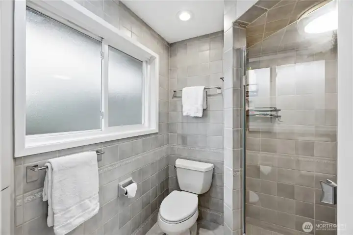 Primary bathroom wall to ceiling tile.