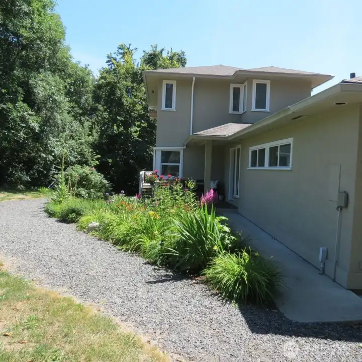 Main entrance into this large 4+ bedroom home. Covered front porch with seating and new Trex decking.