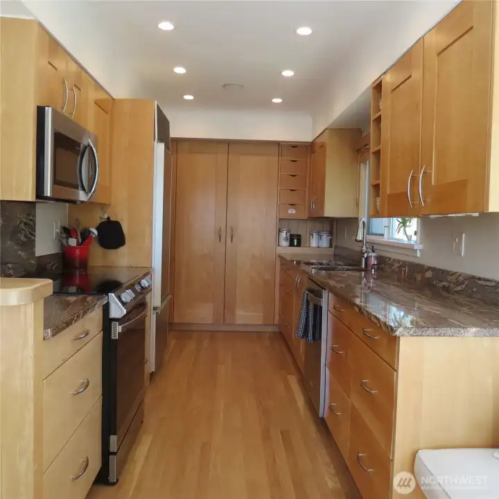 Other end of the kitchen looking back toward the double door closet pantry.