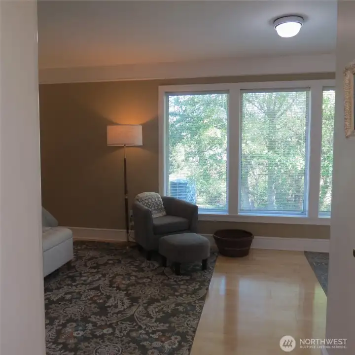 Walking into the large upper level primary suite.