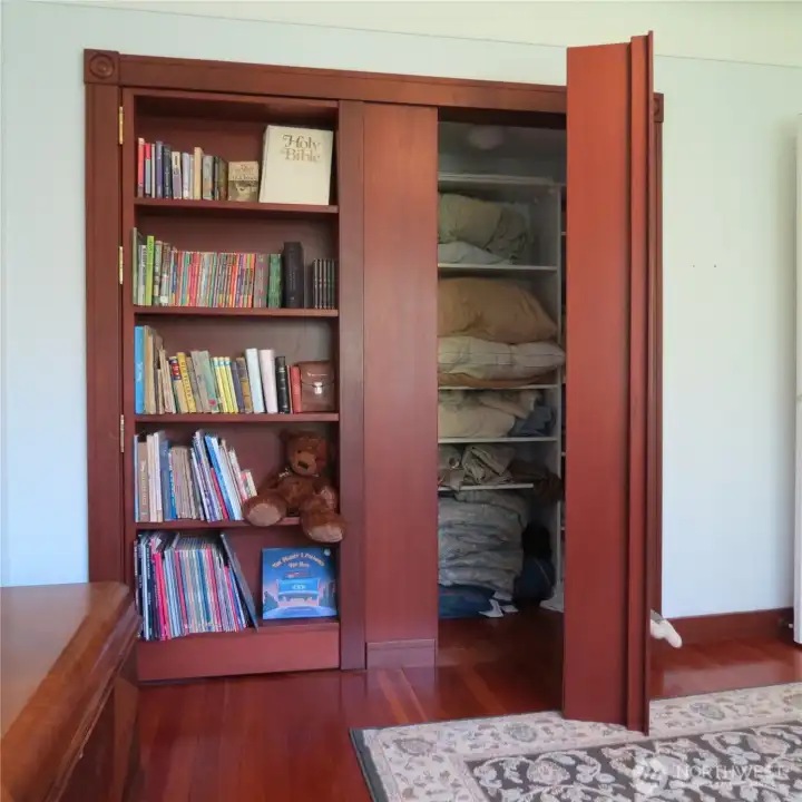 The bookshelves are also hidden closets!
