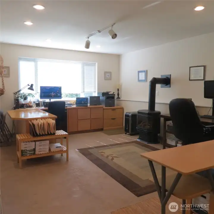 Welcome to the fully finished daylight basement with its own private entrance, radiant floor heating, standalone propane fireplace, kitchenette, bathroom, sleeping area, etc. This is a perfect office/home business space, MIL, long-term rental income producer, etc. that really ups the overall value of this amazing home.