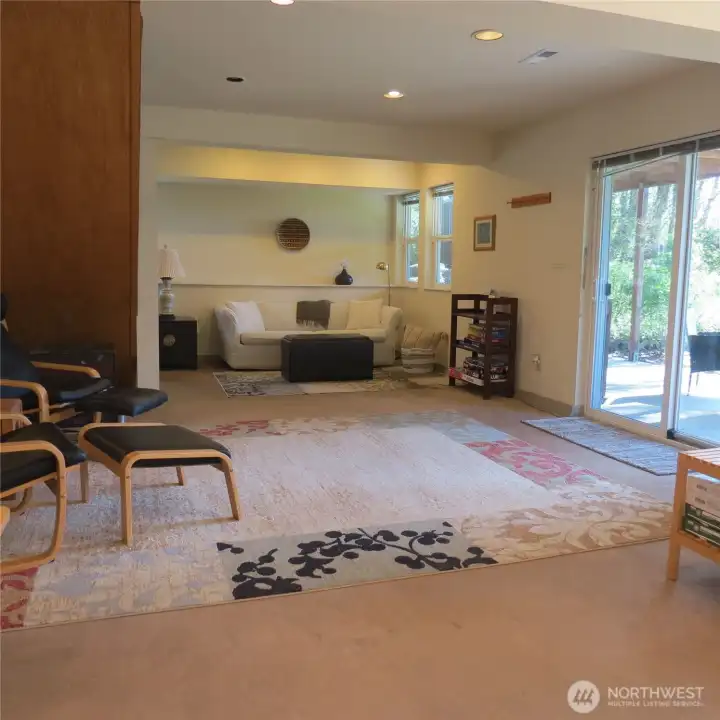 Private entrance into the daylight basement with covered patio area outside.