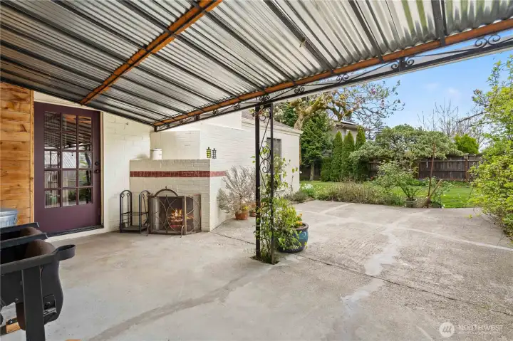 covered back patio with fireplace