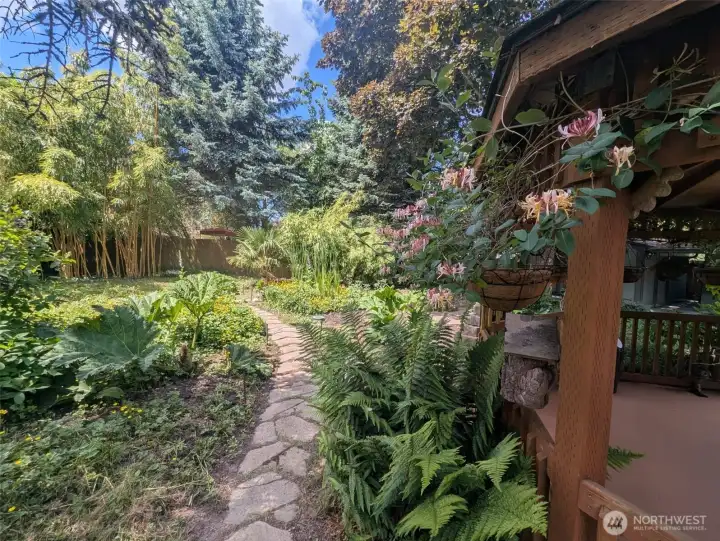 You will be blown away by the magical garden at this property! The house comes with it too.