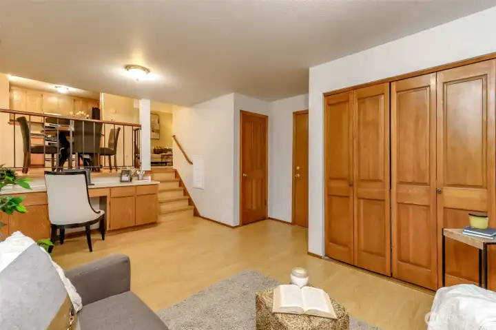 Lower level family room, washer and dryer in cabinent