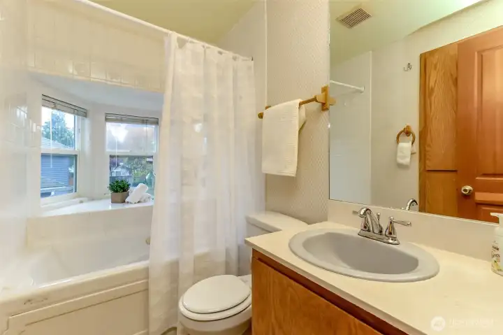 Top of the stairs full spa like bathroom with jetted tub