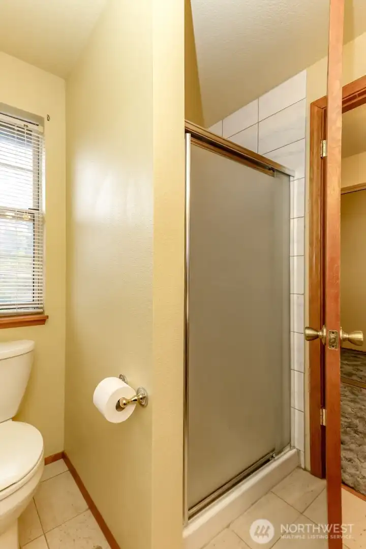 Primary three quarter bathroom shower