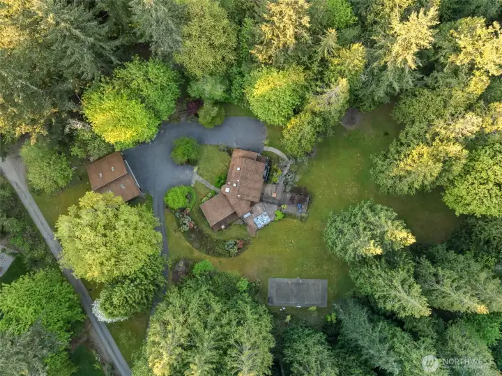 Shop, sport court, and 6 usable acres to explore or build on