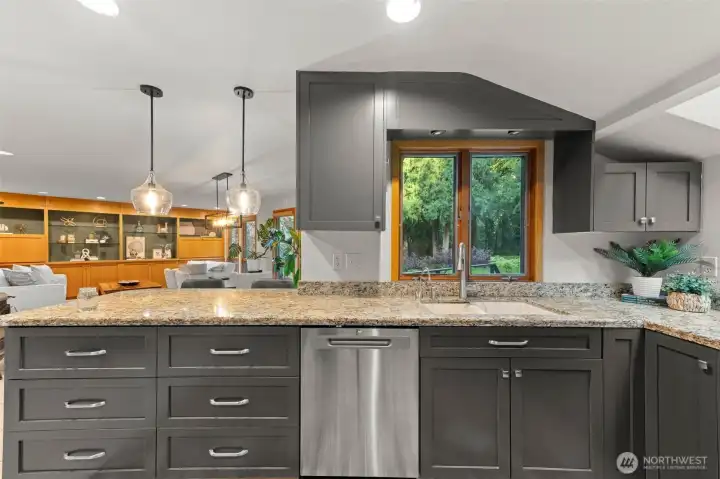 The kitchen is centered between two seperate living areas