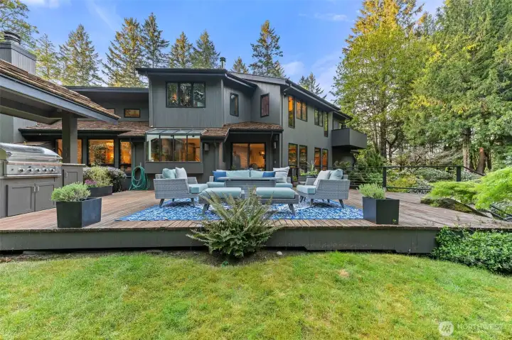 one of 3 backyard decks with grilling station