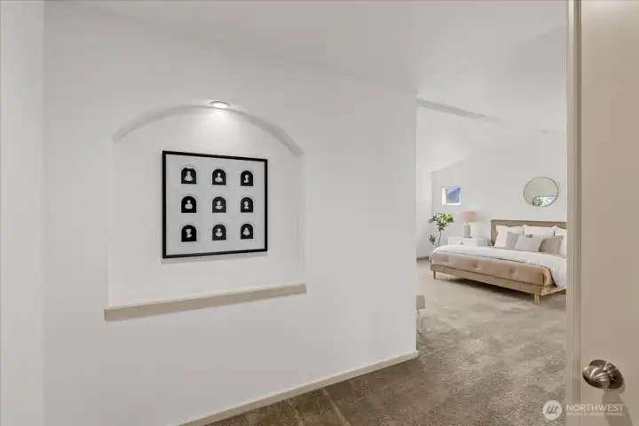 Private entrance to the primary suite with thoughtful architectural details and an open, welcoming transition into the bedroom.