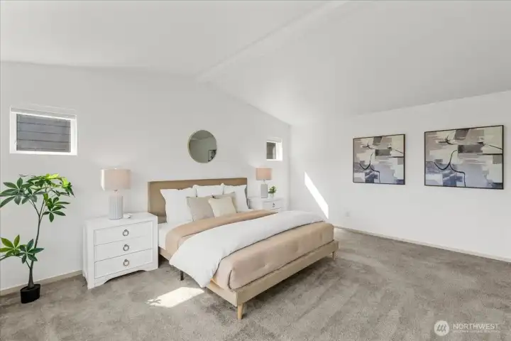 Expansive primary suite with elevated ceiling lines, large windows, and ample space for a sitting area or additional furnishings.