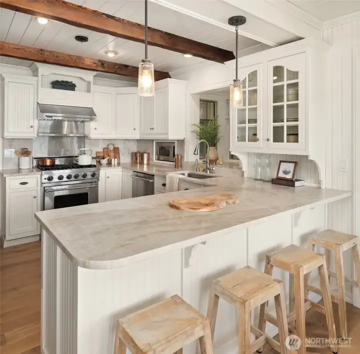 Custom kitchen featuring Viking appliances, quartzite surfaces, and handcrafted details throughout.