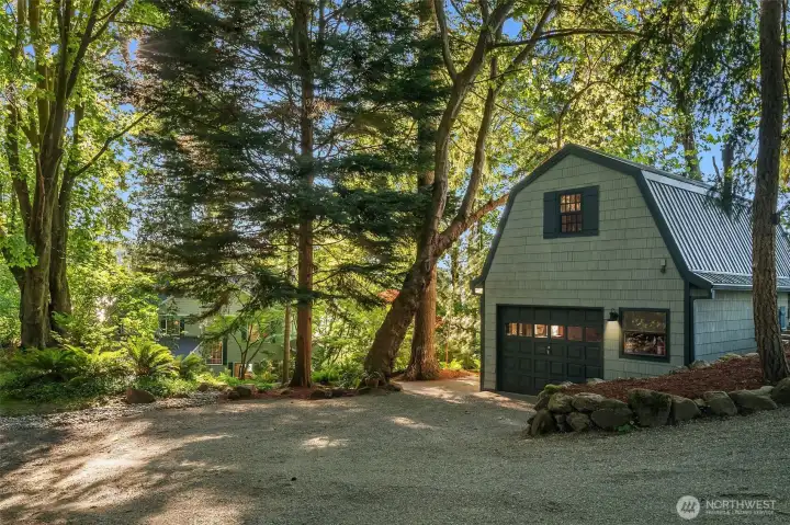 Detached garage with charming carriage house accommodations above.