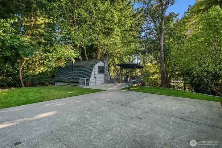Detached garage, generous off-street parking, and a versatile sport court provide space for recreation, guests, and everyday convenience.
