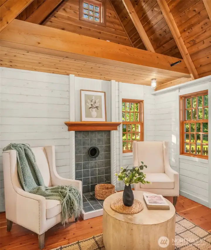 Cozy sitting room with soaring ceilings and warm wood finishes