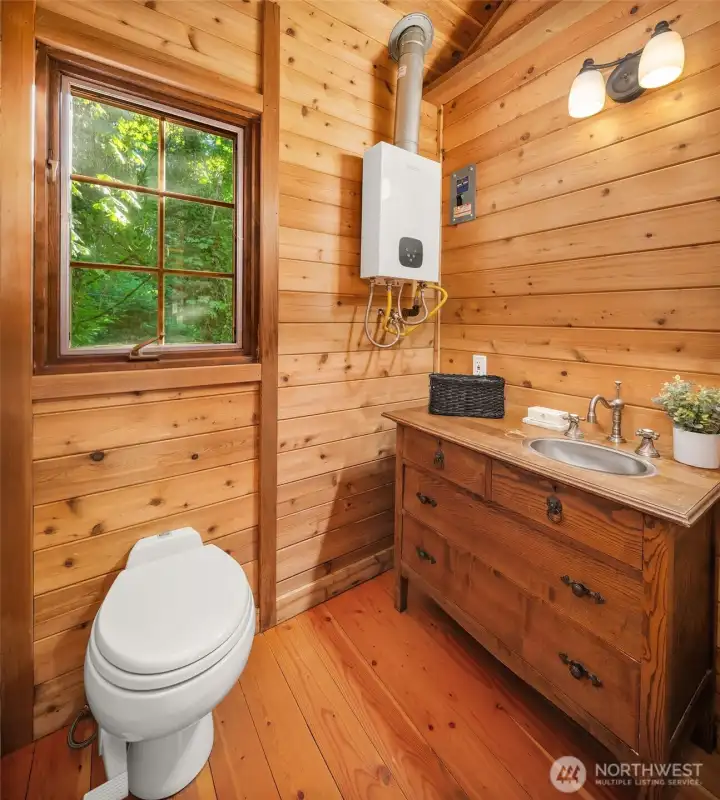 Rustic bath with warm wood finishes and cottage-inspired character.