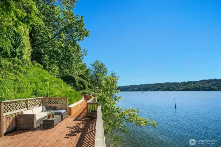 Spanning the water's edge, the generous boardwalk offers multiple places to relax, entertain, and step directly onto the beach.