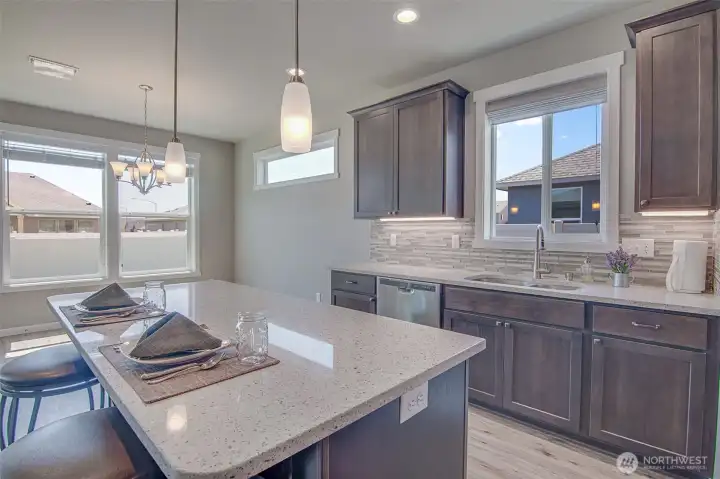 Kitchen with dining space just beyond the counters for simple stove to table serving.