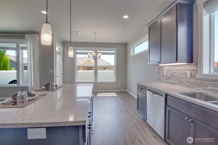 Kitchen with dining space just beyond the counters for simple stove to table serving.