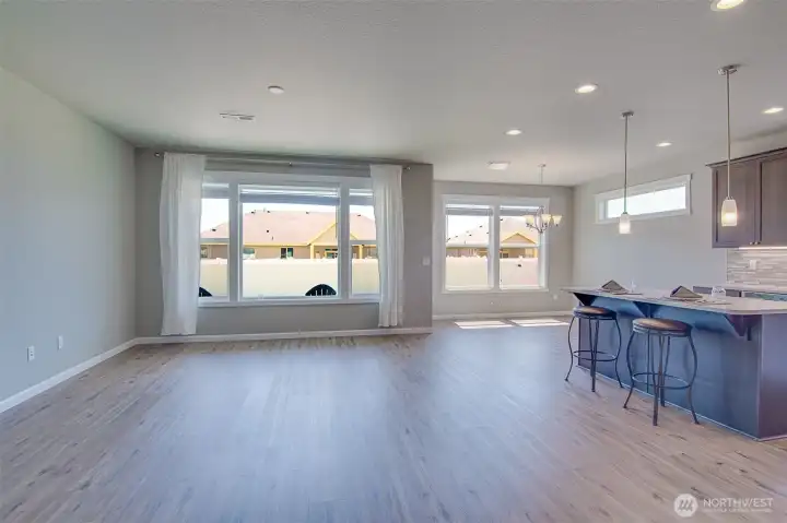 Family room, kitchen, and dining areas from the entry hall.