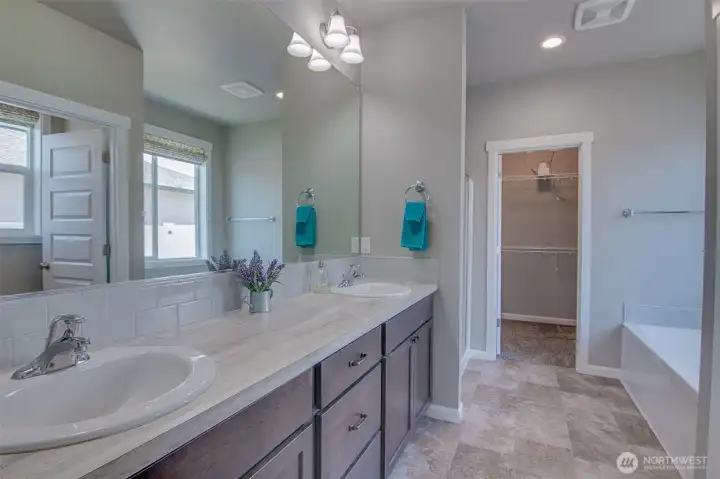 Primary Bathroom and closet from Primary Bedroom