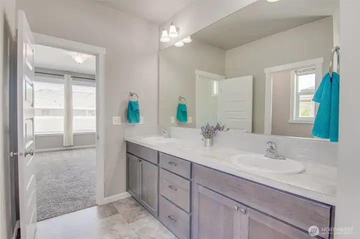 Primary Bedroom and Primary Bathroom Double Vanity from soaking tub