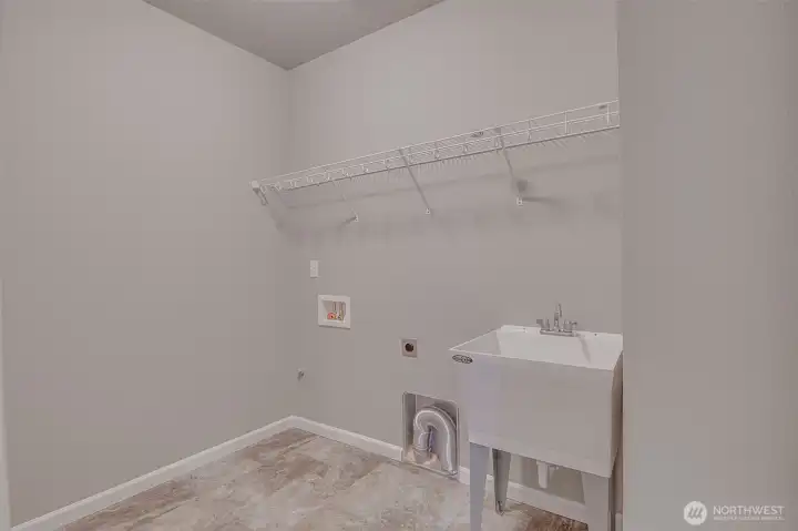 Laundry Room with Deep Sink just inside from the garage and steps from Bedroom 2 & 3.