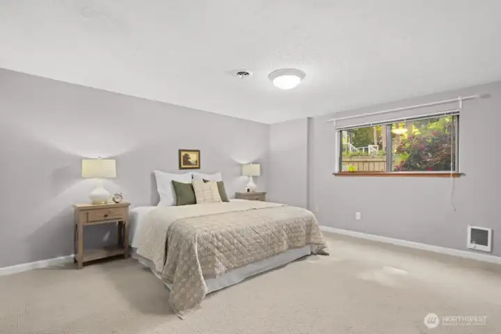 Basement bedroom with window to backyard
