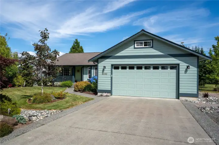 Attached two-car garage with ample driveway parking.